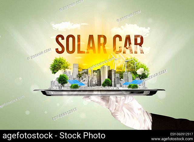 Waiter serving eco city with SOLAR CAR inscription, renewabke energy concept