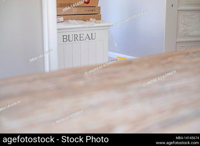 construction site, refurbishment and renovation of an apartment, detail of a cabinet with moving boxes