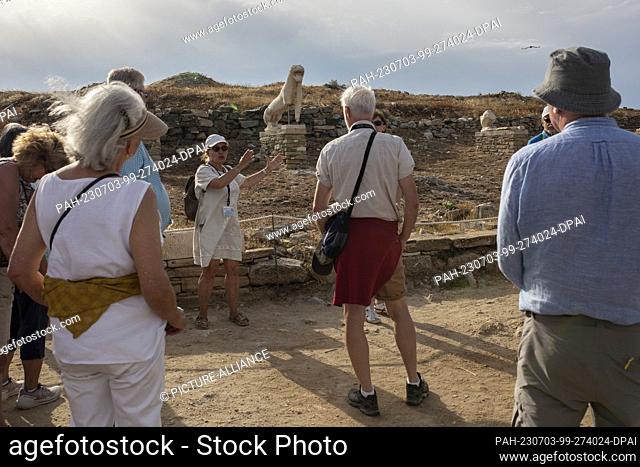 15 June 2023, Greece, Insel Delos: Tourists at the archaeological site of Delos Island, near Mykonos. Delos is one of the most important mythological