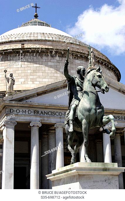 The equestrian bronze statue of Charles III of Borbone in front of Church of San Francesco di Paola on the Piazza del Plebiscito. Naples. Campania