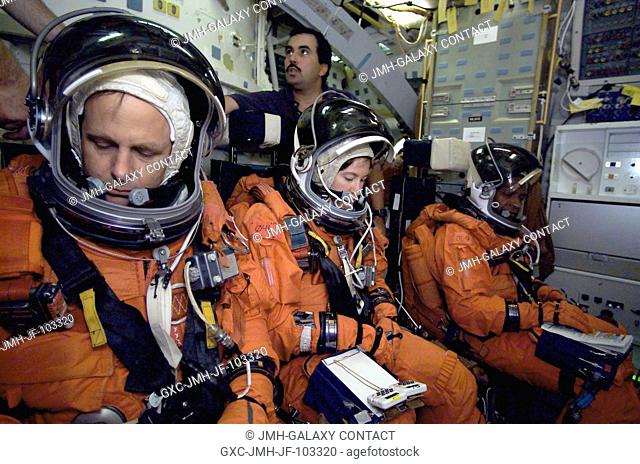 STS-107 payload specialist Ilan Ramon (left), astronauts Laurel B. Clark, mission specialist, and Michael P. Anderson, payload commander