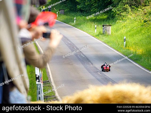 28 May 2022, Hessen, Schotten: Marcel Paul from Hesse races his modified bobby car down the slope in the Sichenhausen district