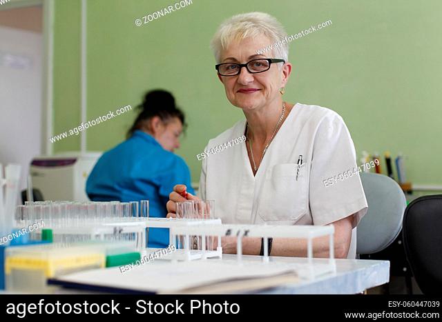 Doctor with test tubes with assays.Doctor the laboratory assistant