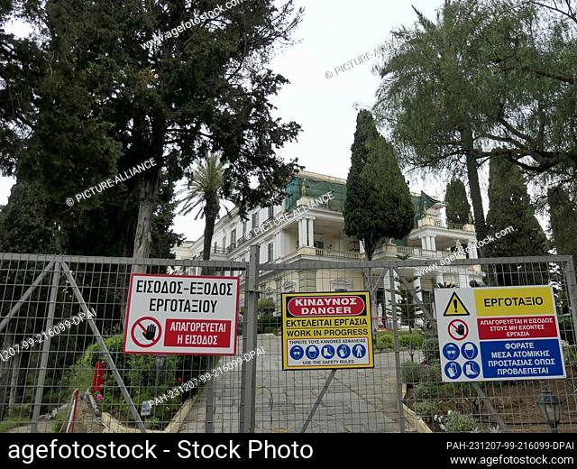 06 May 2022, Greece, Gastouri: A fence with signs, work in progress, blocks the entrance to the Achilleon, former summer palace of the Austrian Empress...