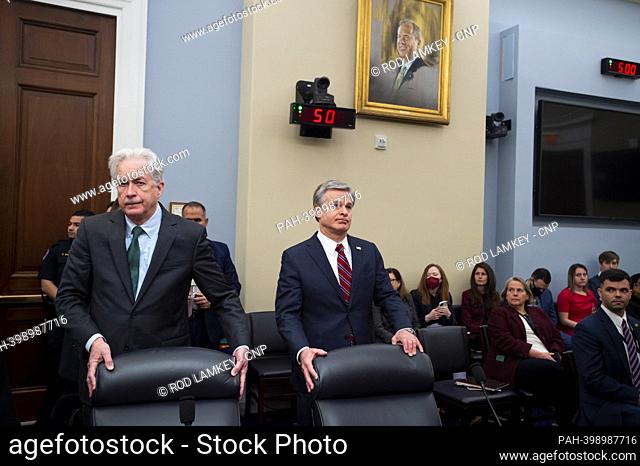 Director, William J. Burns, Central Intelligence Agency, left, and Director, Christopher Wray, Federal Bureau of Investigation, right