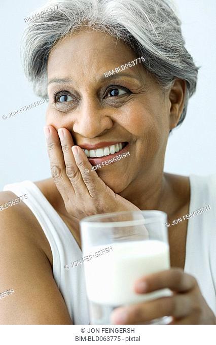African woman drinking milk