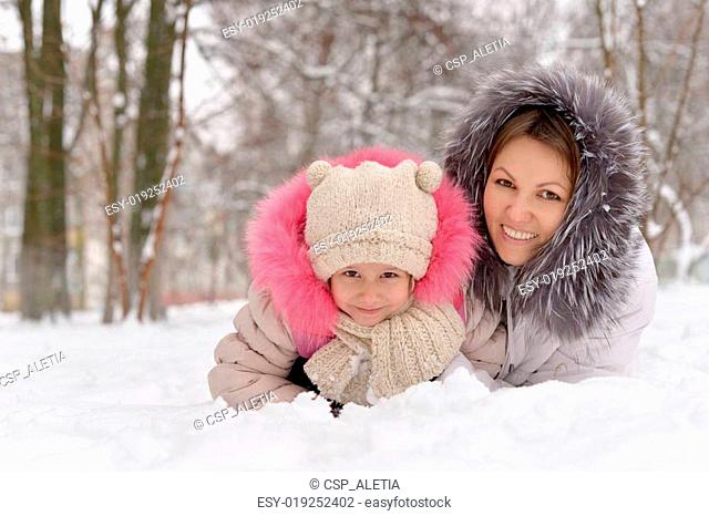 Mother and daughter in the snow