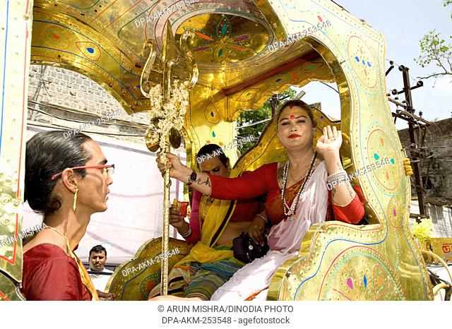 Transgender sitting in horse cart, ujjain, madhya pradesh, india, asia