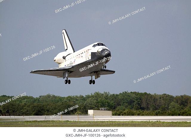 Space Shuttle Discovery approaches landing on Runway 15 of the Shuttle Landing Facility at NASA's Kennedy Space Center, concluding the 13-day, 5