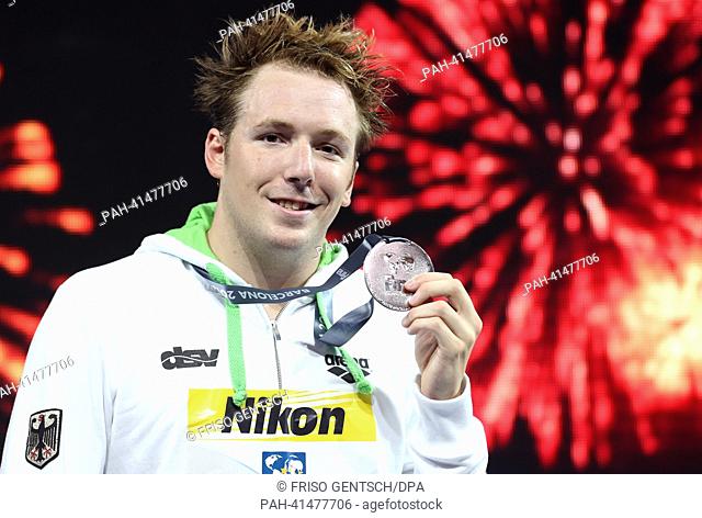 Silver medal winner Marco Koch of Germany poses with his medal after the men's 200m Breaststroke final of the 15th FINA Swimming World Championships at Palau...