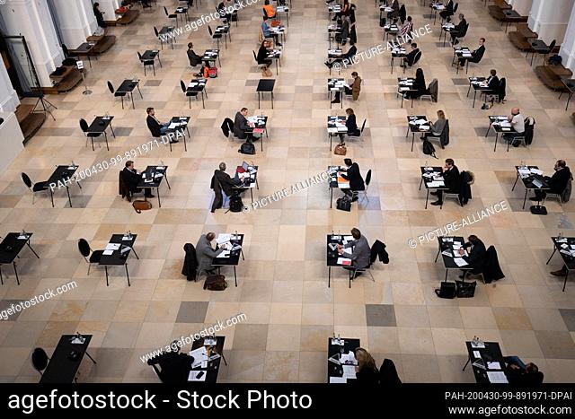 03 April 2020, Hamburg: The members of the new plenum of the Hamburg Chamber of Commerce attend the first meeting in the Exchange Hall of the Chamber building...