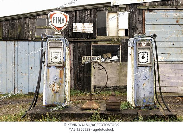 Old petrol pumps on garage forecourt in rural Lancashire, England, UK