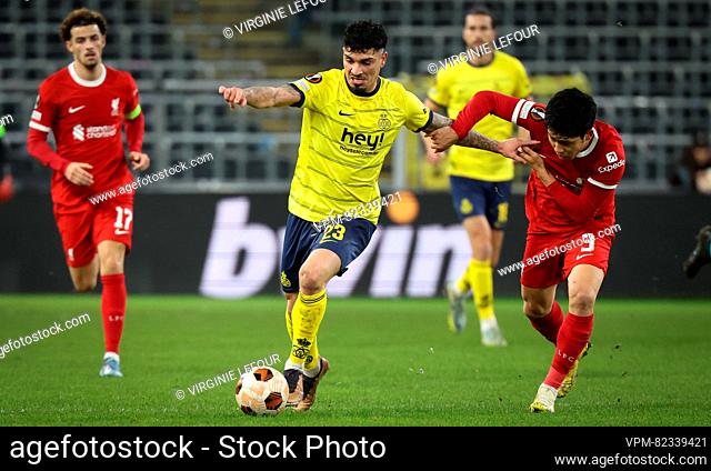 Union's Cameron Puertas Castro and Liverpool's Wataru Endo fight for the ball during a game between Belgian soccer team Royale Union Saint Gilloise and English...