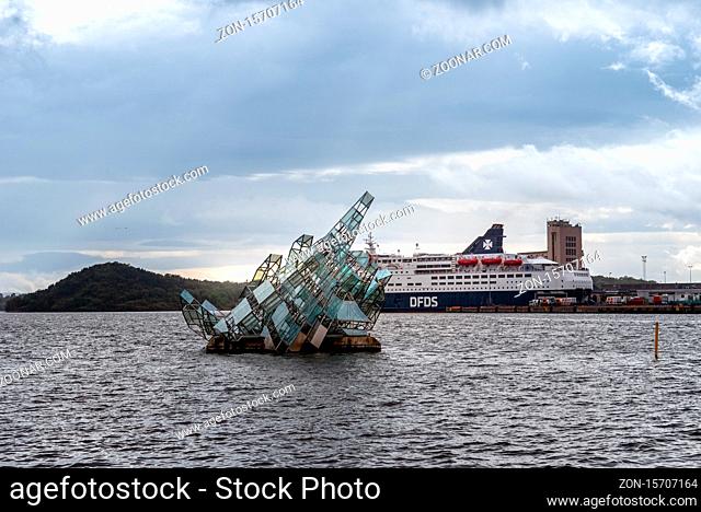 Oslo, Norway - August 11, 2019: Hun ligger or She lies monument in the harbour with cruise ship on background