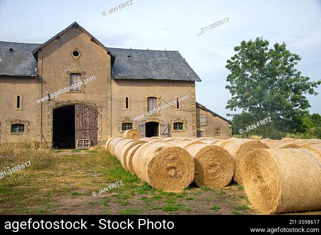 old shed at farm with hay rolls in Bourgogne, France