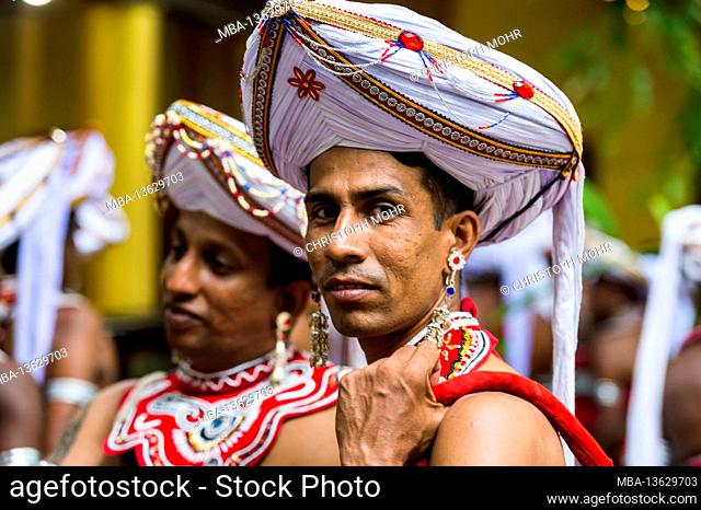 Sri Lanka, Colombo, Gangaramaya temple, the Nawam Maha Perahera festival, men, costumes, portrait