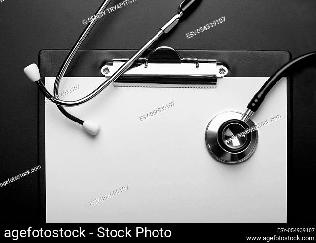 Empty clipboard with medical stethoscope
