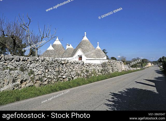 Puglia, Italy, Europe, Trulli and dry stone walls on the SS 581 road between Massafra and Martina Franca