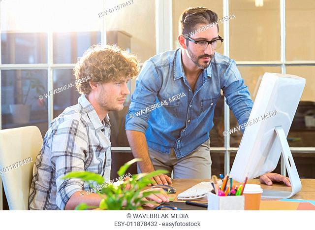 Concentrated business team working on computer