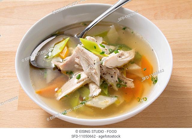 Clear soup with chicken and vegetables
