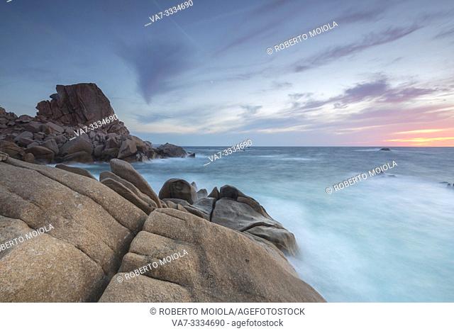 Sunset on modeled cliffs by wind framing blue sea Capo Testa Santa Teresa di Gallura Province of Sassari Sardinia Italy Europe