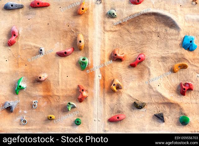 Artificial indoors rock climbing wall background