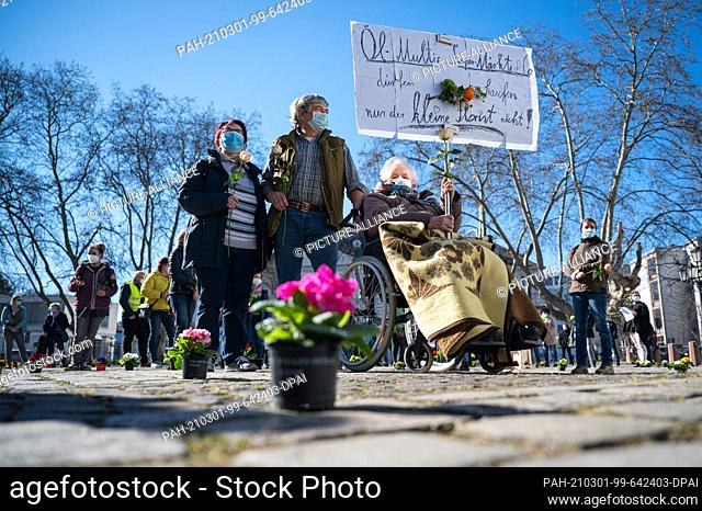 01 March 2021, Saarland, Saarbrücken: Florists and gardeners have gathered on Ludwigsplatz for a rally to protest for the opening of their shops
