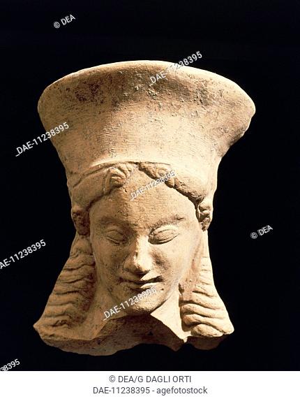 Female head, fragment of a terracotta votive statue from Policoro, Calabria, Italy. Ancient Greek civilization, Magna Graecia