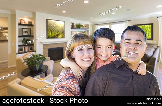 Happy young mixed-race family portrait in living room of home