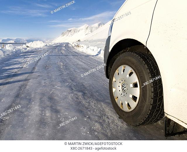 Icy and slippery road with vehicle equipped with spiked tyres during winter near Stokksnes. europe, northern europe, iceland, February