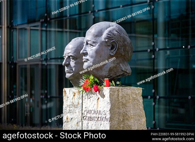 31 August 2022, Russia, Moskau: Flowers lie at the monument ""Fathers of Unity"" by the French sculptor Serge Mangin at the head of the last president of the...