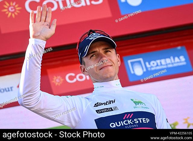 Belgian Remco Evenepoel of Quick-Step Alpha Vinyl celebrates on the podium in the white jersey for best young rider after stage 13 of the 2022 edition of the...