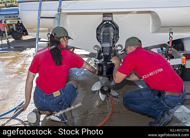 Evanston, Wyoming - Employees of the Wyoming Game & Fish Department inspect and decontaminate watercraft at a mandatory inspection station along the Utah border