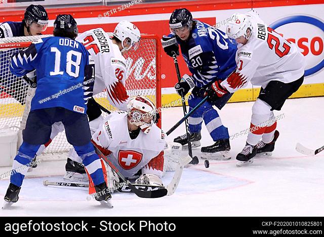 L-R Patrik Puistola and Joonas Oden (both FIN), David Aebischer and goalkeeper Stephane Charlin (both SUI), Matias Maccelli (FIN) and Tim Berni (SUI) in action...