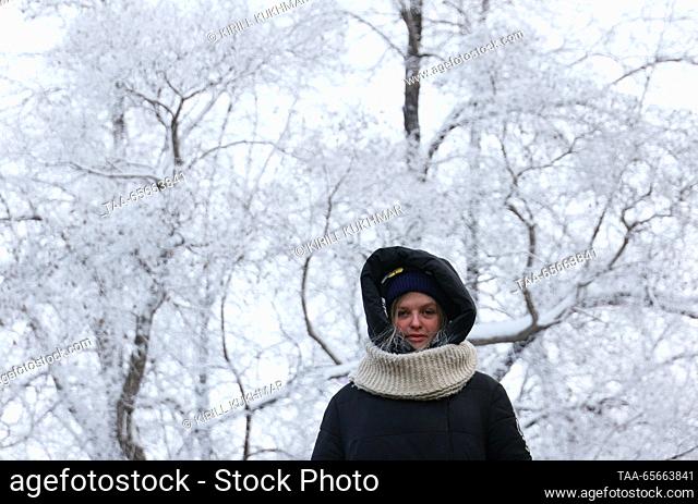RUSSIA, NOVOSIBIRSK - DECEMBER 12, 2023: A woman is seen in a park in Central District during severe frost in winter. On 11 December