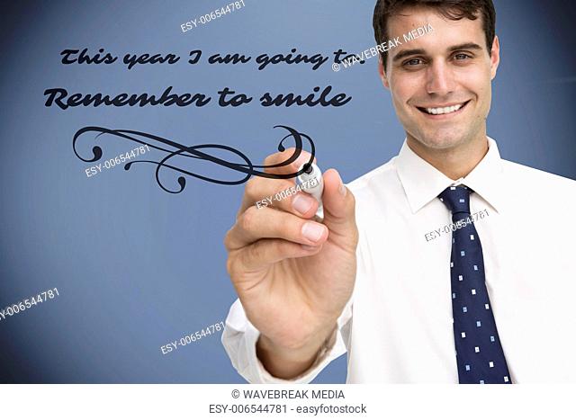Composite image of smiling businessman holding marker