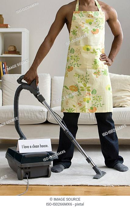 A man vacuum cleaning