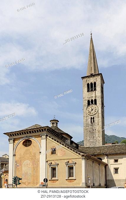 view of rear side and bell tower of Romanesque S. Ambrogio church, shot on bright summer day at Omegna, Verbania, Cusio, Italy