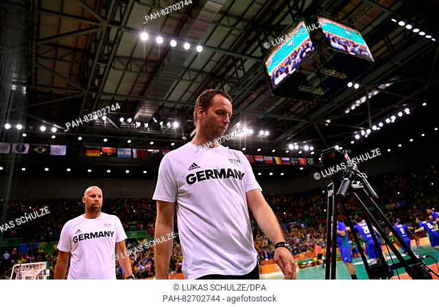 Assistant coach Axel Kromer (L) and head coach Dagur Sigurdsson of Germany react during the Men's Preliminary Group B match between Brazil and Germany of the...
