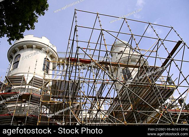 31 August 2021, Berlin: The palace on Pfaueninsel, located on the border with Brandenburg, is partially covered in scaffolding
