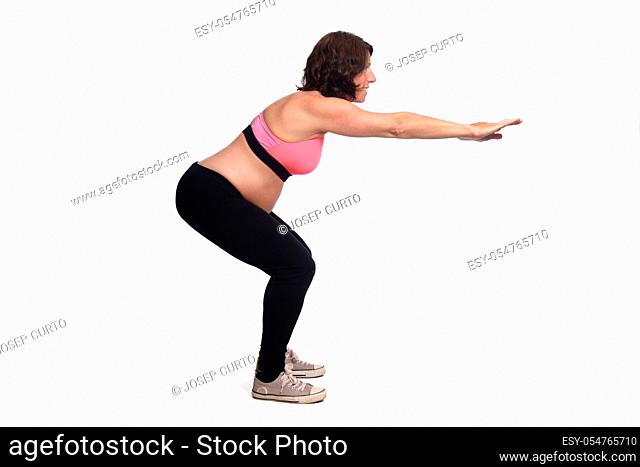portrait of a pregnant woman exercising on white background