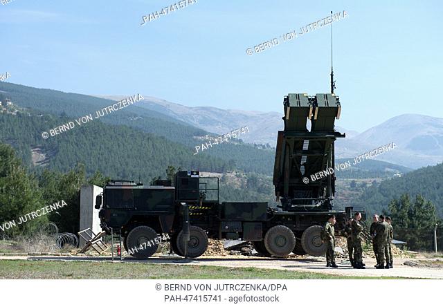 German soldiers stand in front of a 'Patriot' surface-to-air missile systems of the German Bundeswehr in Kahramanmaras, Turkey, Germany, 25 March 2014
