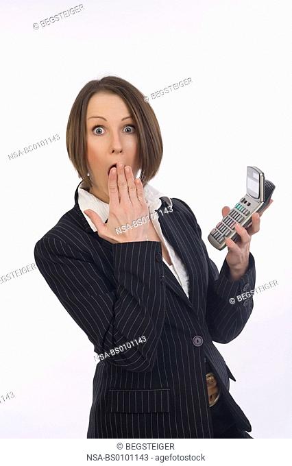 shocked business woman with pocket calculator