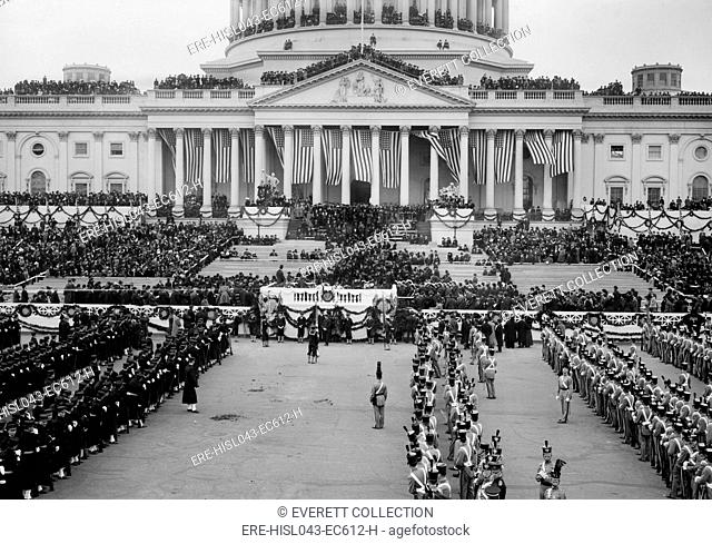 The East Front of the Capitol and plaza on Woodrow Wilsons inauguration day, March 4, 1913. Columns of military cadets in front of the Presidents platform