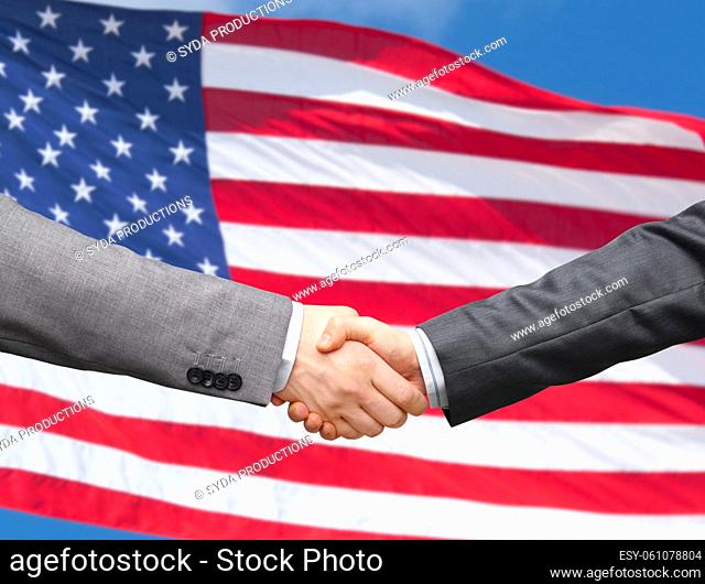 handshake over flag of united states of america