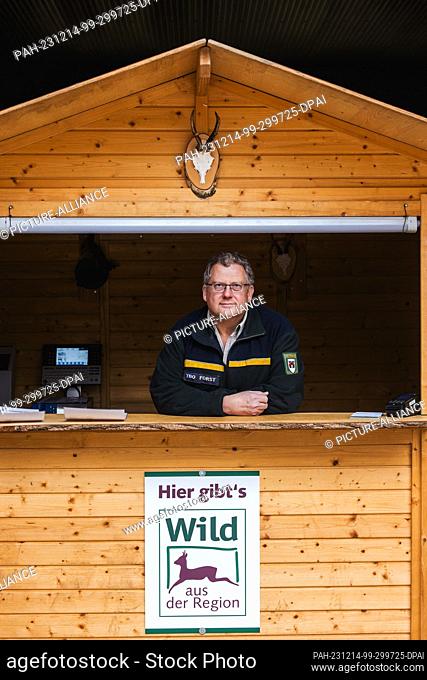 PRODUCTION - 29 November 2023, Baden-Württemberg, Offenburg: Andreas Broß, head of the Offenburg forestry department, stands in a wooden hut in a municipal...