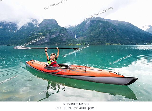 Boy sea kayaking