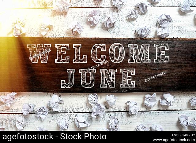 Handwriting text Welcome June, Business concept Calendar Sixth Month Second Quarter Thirty days Greetings Important Ideas Written On Piece Of Wood With Paper...