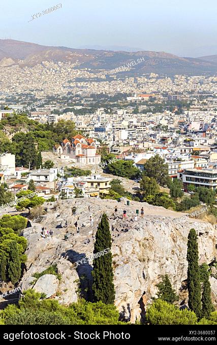 Athens, Attica, Greece. The Areopagus Hill and the Greek Orthodox church of Agia Marina behind, seen from the Acropolis