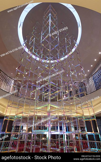 Suspended light sculpture in full-height atrium. Iri-Descent , Fortnum & Mason, London, United Kingdom. Architect: Liz West, 2019